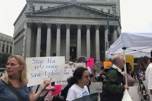 Inwood and other housing activists gather in front of Foley Square following opening arguments for a lawsuit that seeks to overturn the city's rezoning plan.